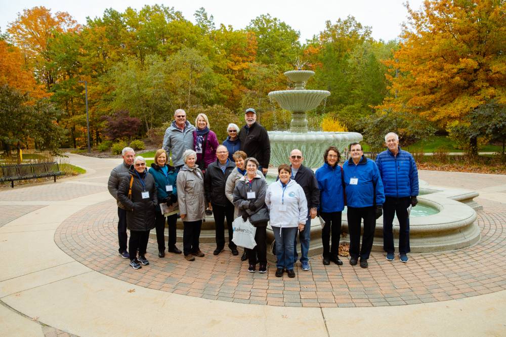 Tour group picture by the Student Services Fountain